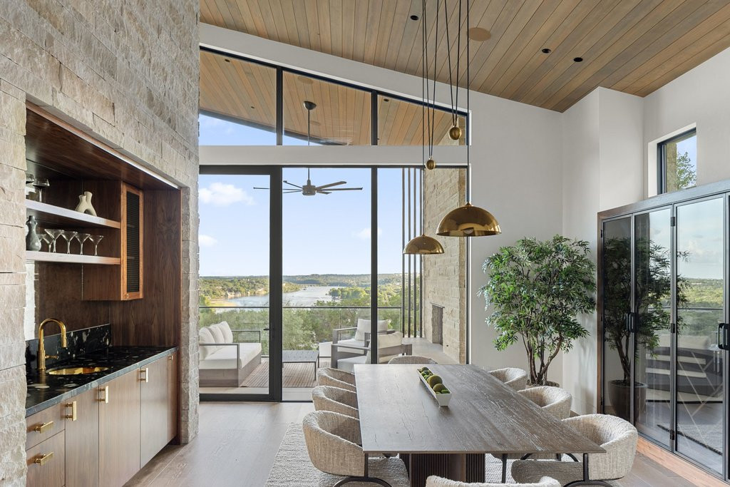 How Long Does It Take to Sell a House in Austin? The 2026 Answer, By the Numbers Modern Austin dining room with lake and hill country view through floor-to-ceiling windows