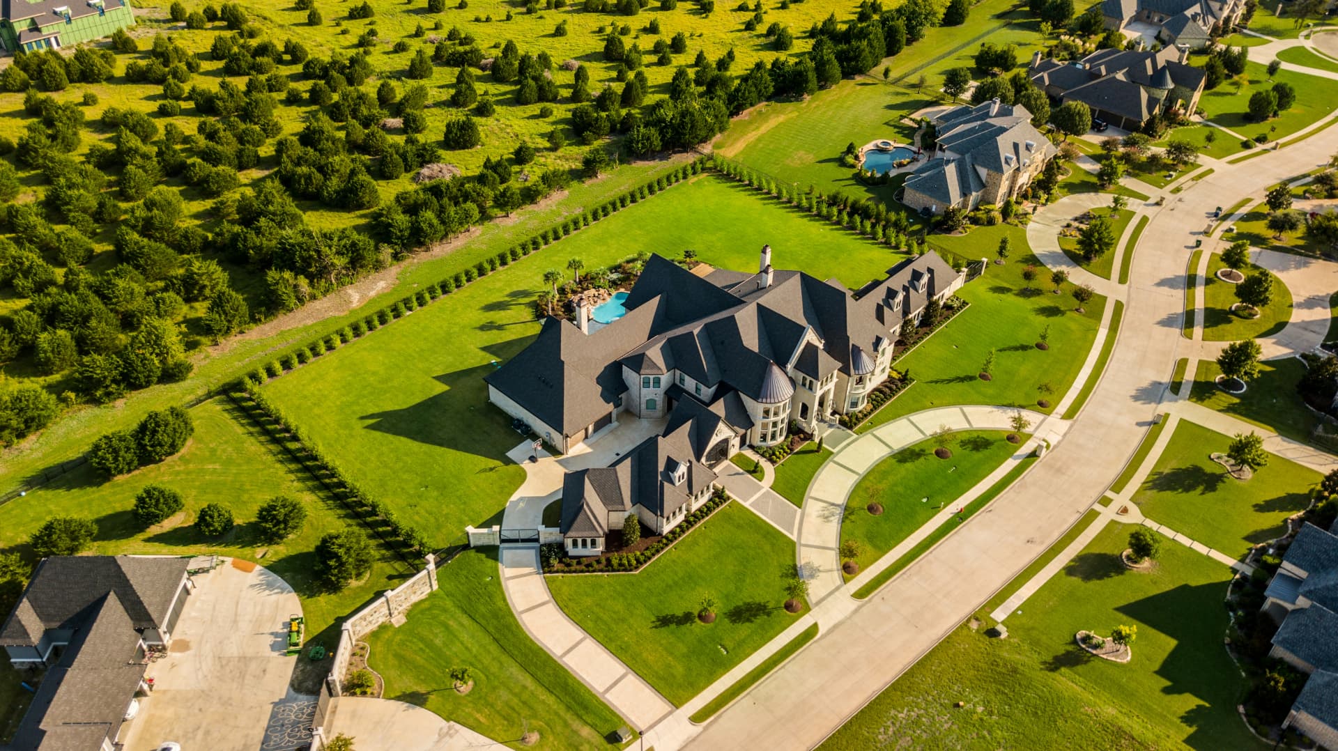 Aerial view of a large Texas luxury estate on acreage, where the sale price never becomes public record